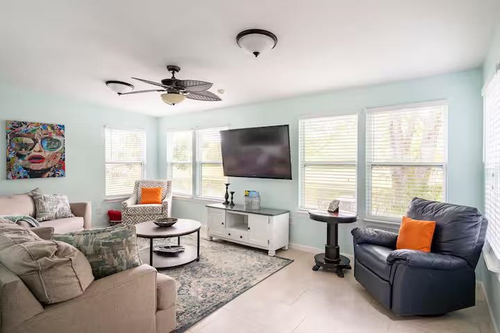 238 Lily Road St. Augustine Shores, FL 32086 - Photo 12 of 22 a living room with furniture and a flat screen tv