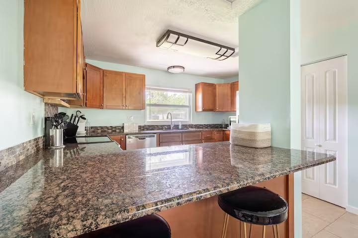 238 Lily Road St. Augustine Shores, FL 32086 - Photo 14 of 22 a kitchen with a stove a sink and a microwave