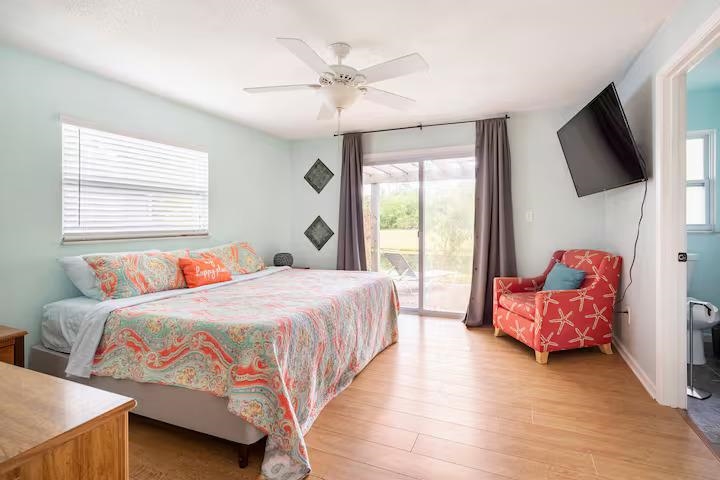 238 Lily Road St. Augustine Shores, FL 32086 - Photo 16 of 22 a bedroom with a bed and a flat screen tv