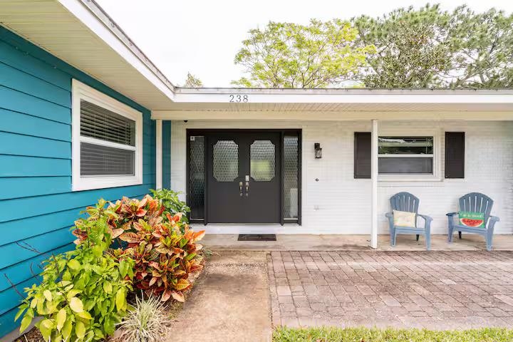 238 Lily Road St. Augustine Shores, FL 32086 - Photo 2 of 22 a front view of a house with garden