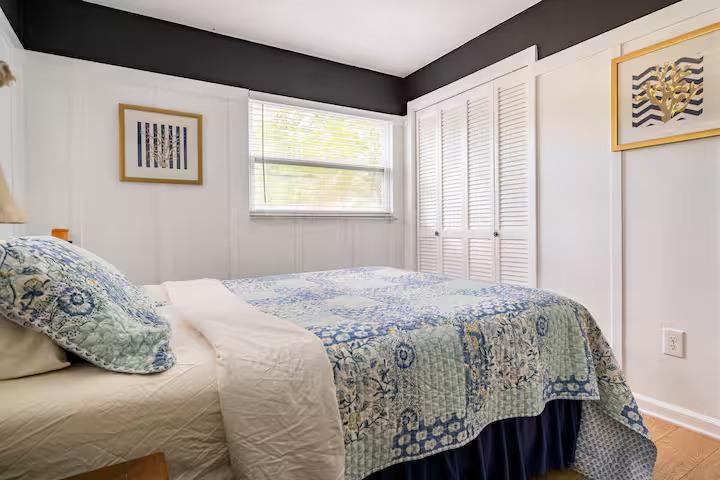 238 Lily Road St. Augustine Shores, FL 32086 - Photo 22 of 22 a bedroom with a bed and a window
