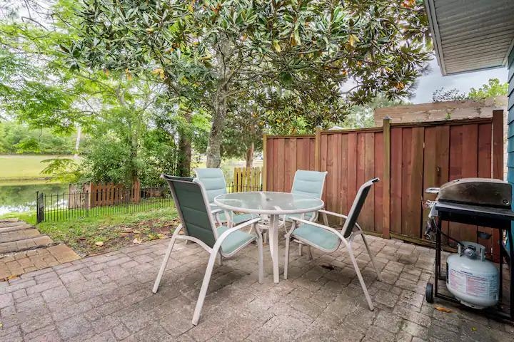 238 Lily Road St. Augustine Shores, FL 32086 - Photo 4 of 22 a view of a chairs and table in the patio