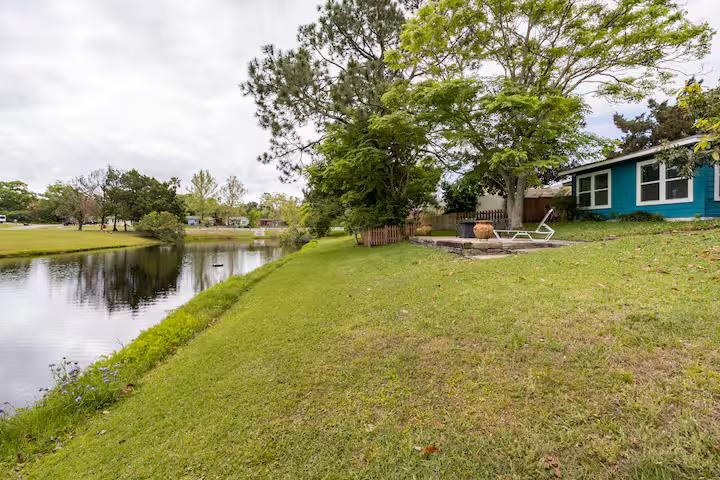 238 Lily Road St. Augustine Shores, FL 32086 - Photo 5 of 22 a view of a house with a yard and sitting area