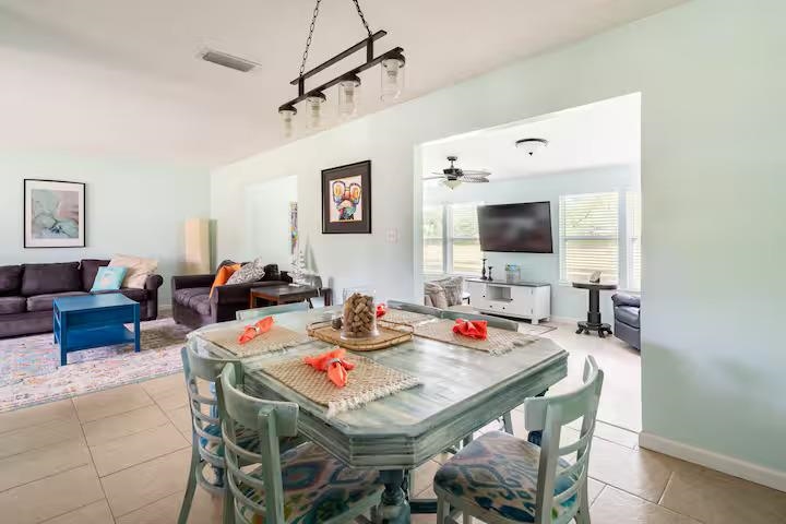 238 Lily Road St. Augustine Shores, FL 32086 - Photo 10 of 22 a view of a dining room with furniture and a flat screen tv