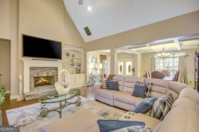 a kitchen with granite countertop a sink cabinets and window