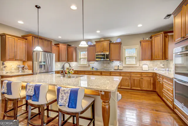 a spacious bathroom with a double vanity sink and a mirror