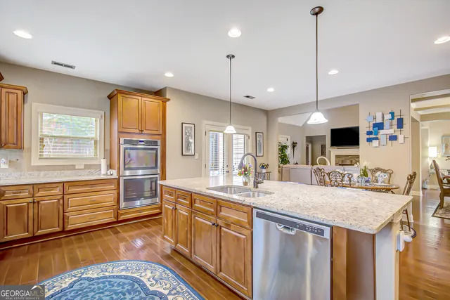 a view of an entryway with furniture and wooden floor