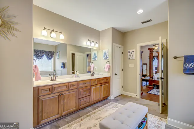 a living room with flat screen tv and a couch
