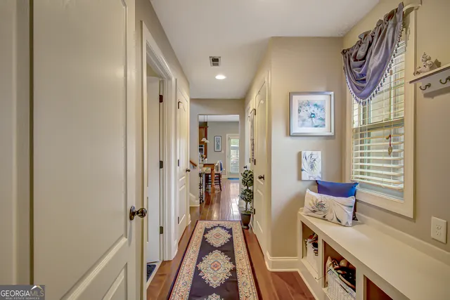 a front view of a house with a potted plant