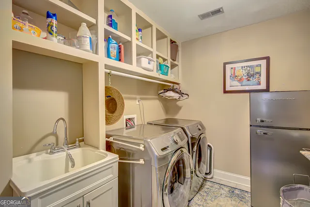 a view of dirt yard with a large tree