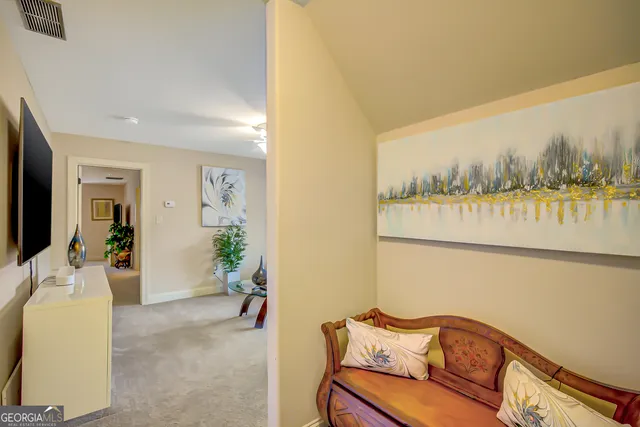 a view of a house with a garden and pathway