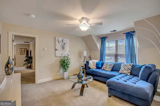 a view of a swimming pool with lounge chairs in patio