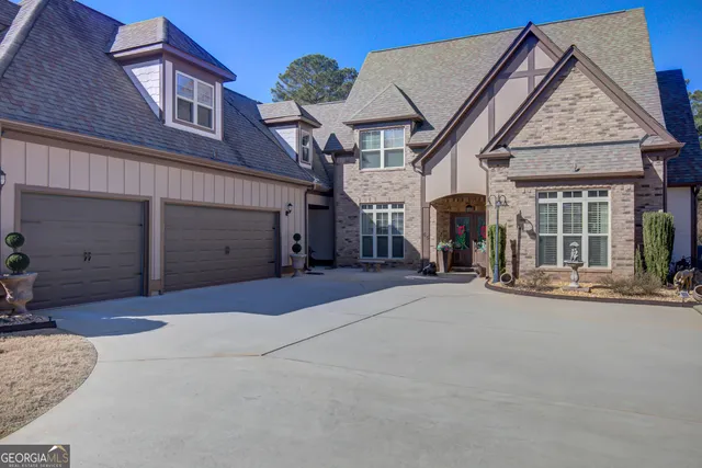 a view of a dining room with furniture wooden floor and chandelier