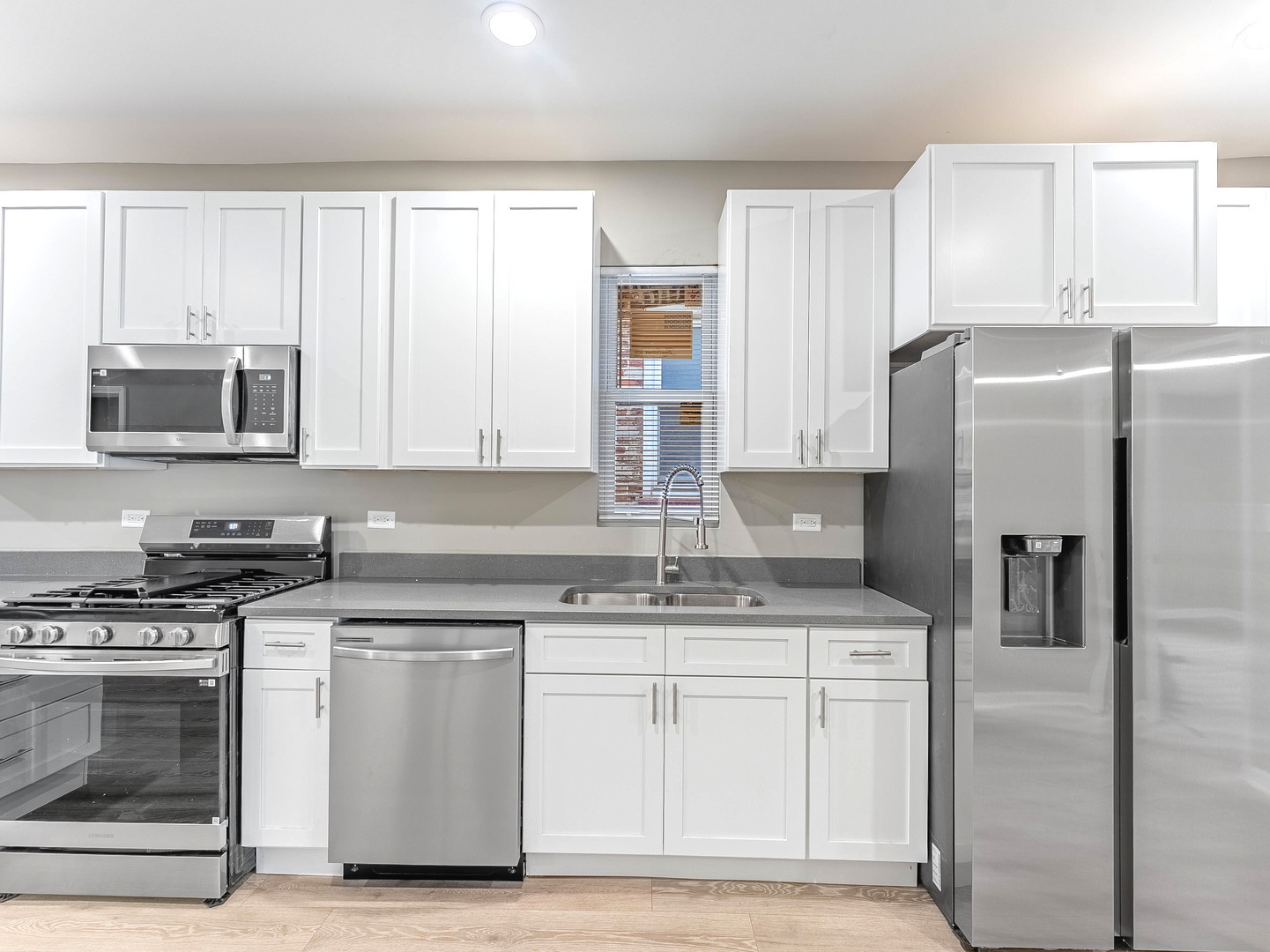 2733 West 38th Street Chicago, IL 60632 - Photo 11 of 30 a kitchen with appliances a sink and cabinets