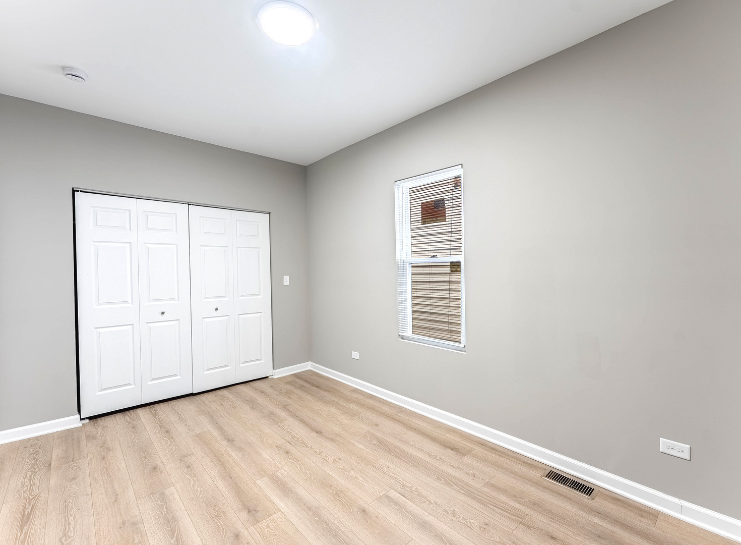 2733 West 38th Street Chicago, IL 60632 - Photo 14 of 30 a view of an empty room with wooden floor and a window