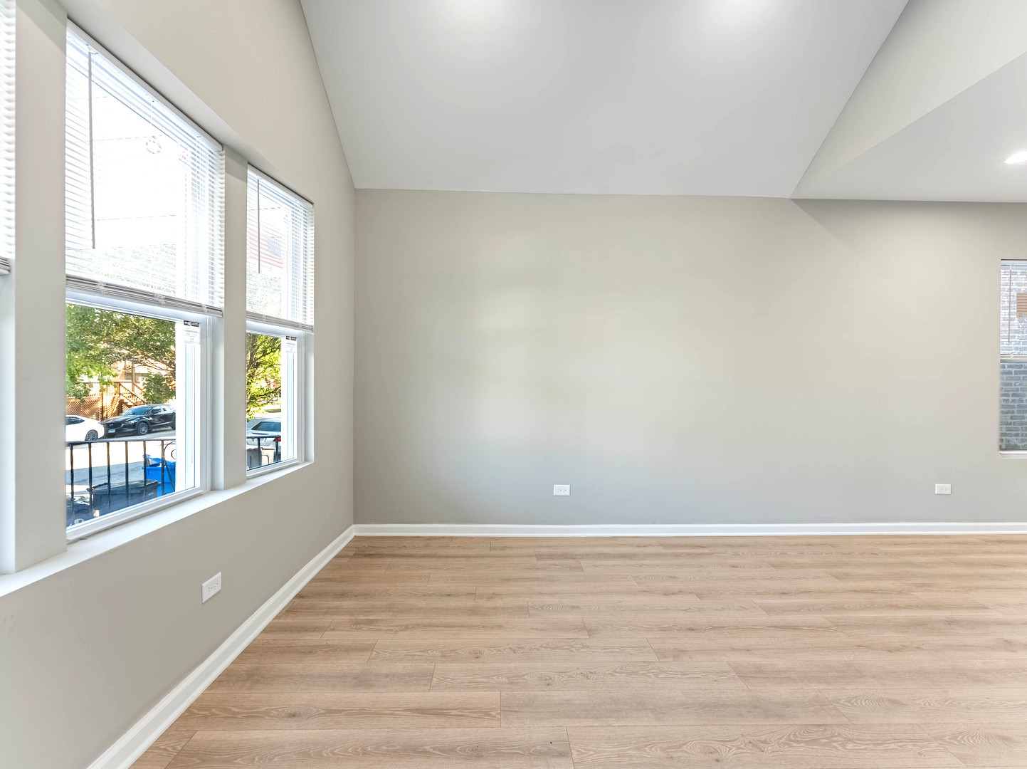 2733 West 38th Street Chicago, IL 60632 - Photo 4 of 30 a view of an empty room with wooden floor and a window