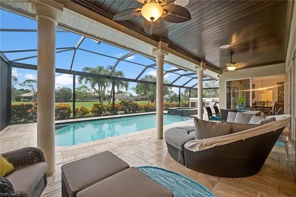 a living room with couch and a floor to ceiling window