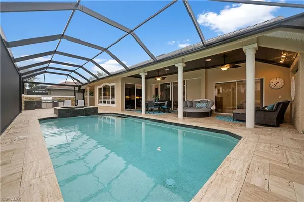 a view of a swimming pool with a patio