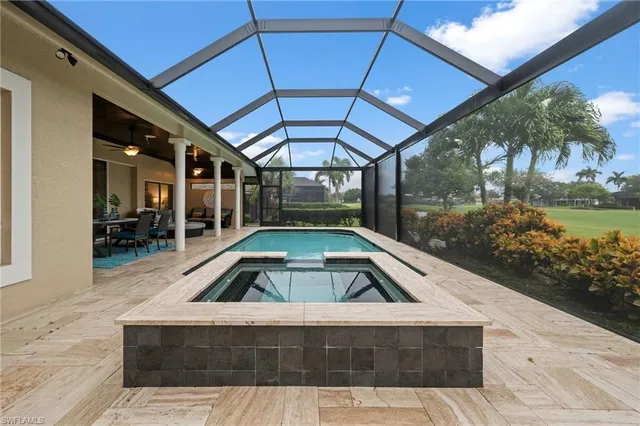 a view of swimming pool with seating area