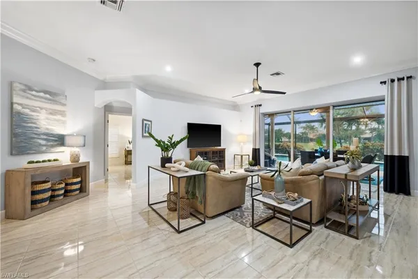 a living room with furniture and a flat screen tv