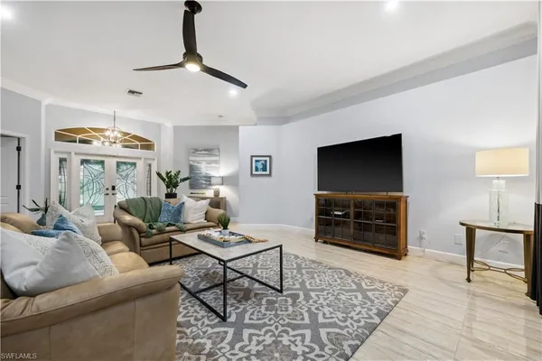 a living room with furniture and a flat screen tv