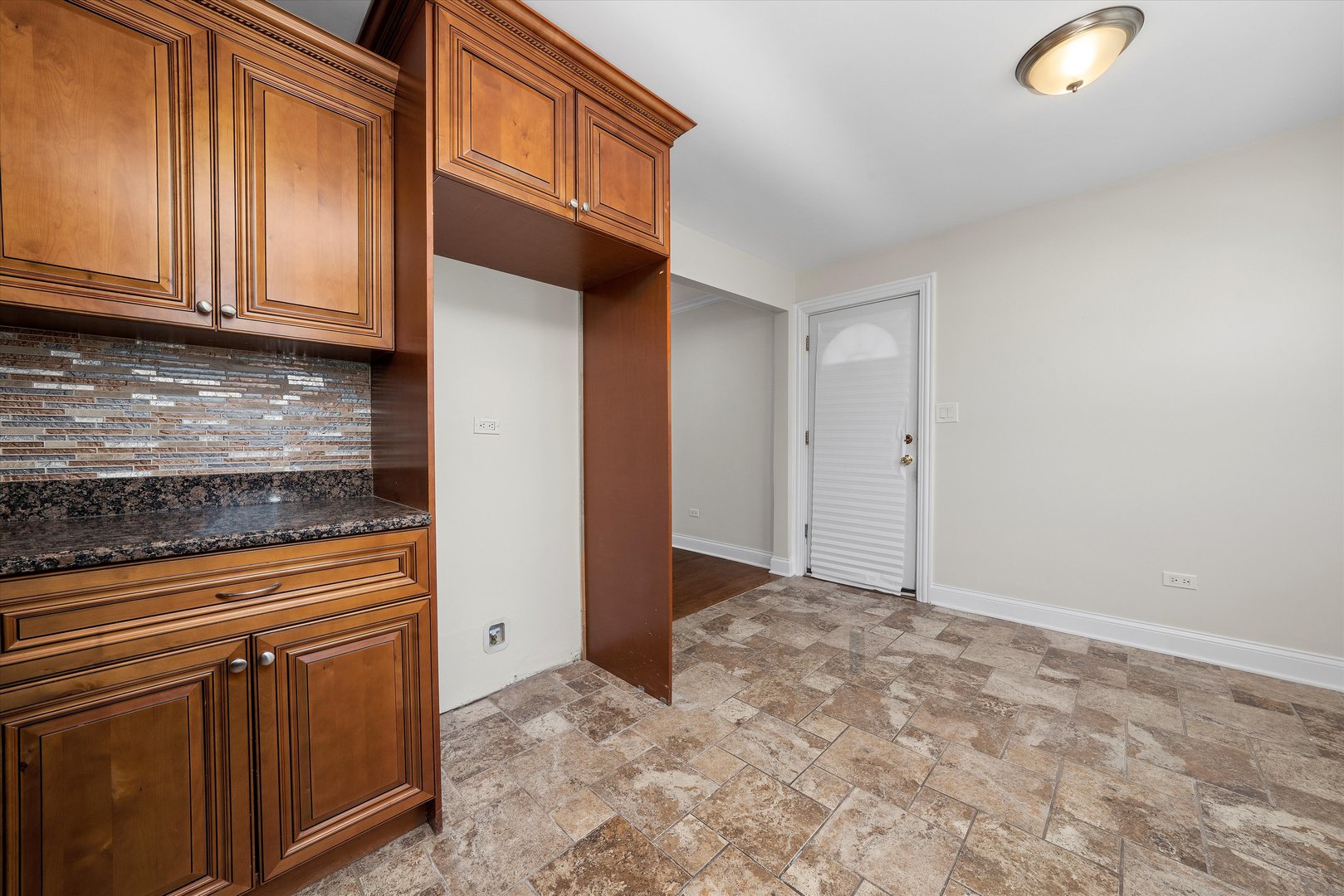 7918 74th Street Bridgeview, IL 60455 - Photo 14 of 26 a view of a kitchen with granite countertop cabinets