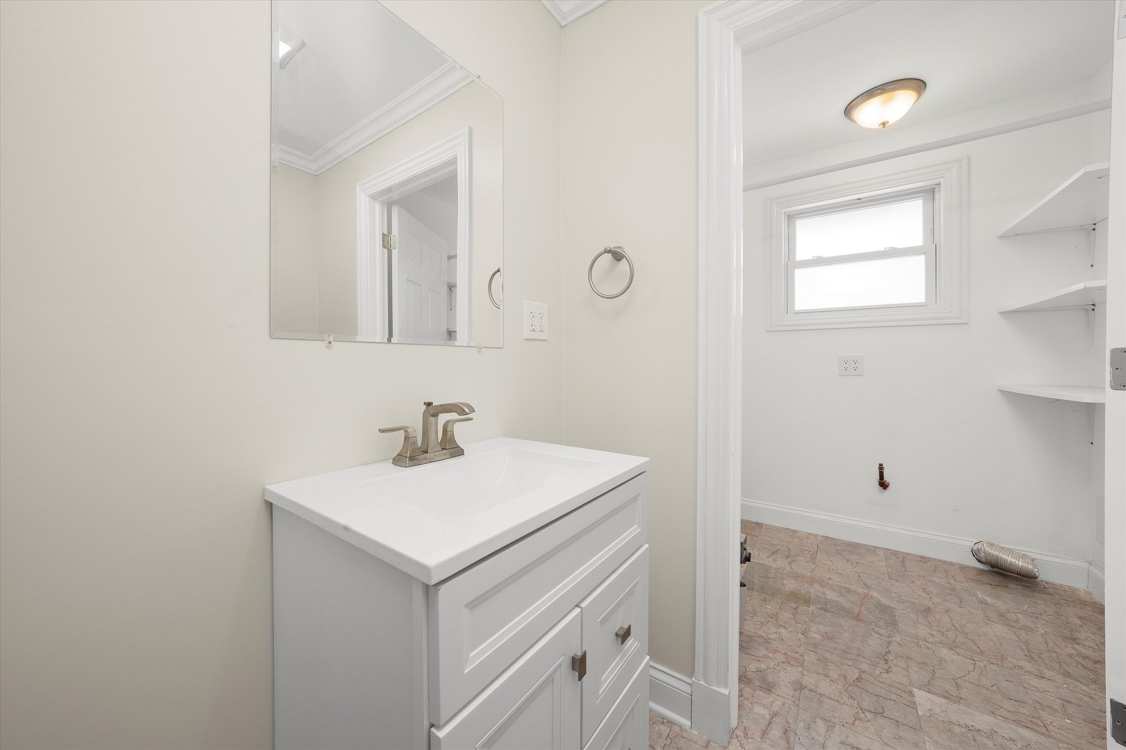 7918 74th Street Bridgeview, IL 60455 - Photo 16 of 26 a bathroom with a sink vanity and a mirror