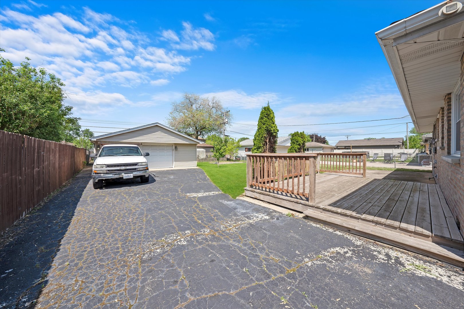 7918 74th Street Bridgeview, IL 60455 - Photo 24 of 26 a view of a yard with wooden fence