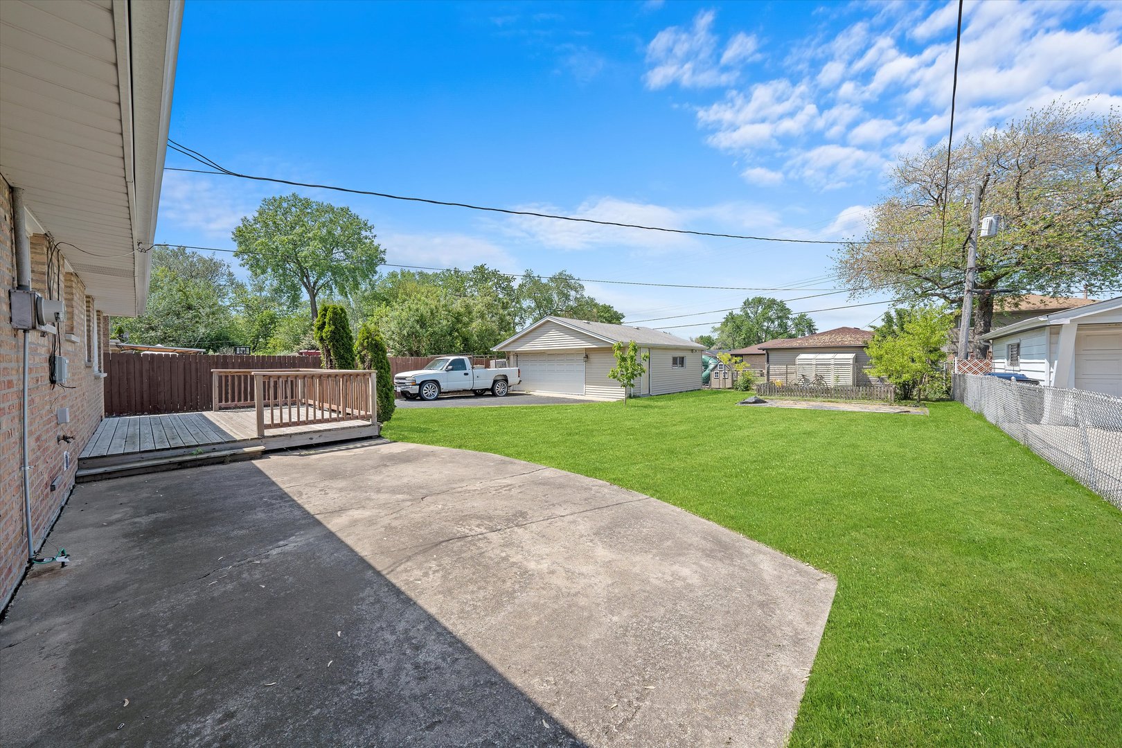 7918 74th Street Bridgeview, IL 60455 - Photo 25 of 26 a view of house with backyard and garden