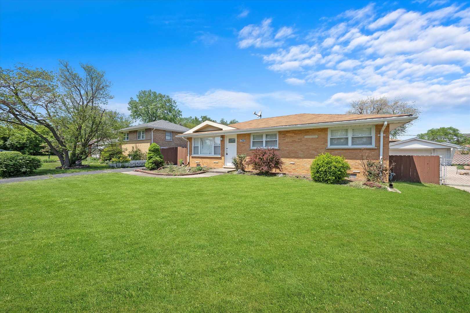 7918 74th Street Bridgeview, IL 60455 - Photo 3 of 26 a front view of house with yard and green space