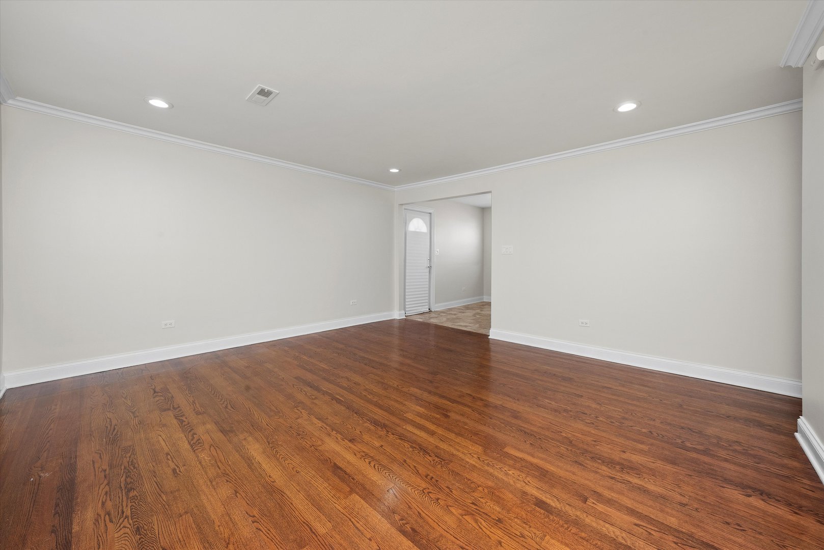 7918 74th Street Bridgeview, IL 60455 - Photo 5 of 26 a view of an empty room with wooden floor