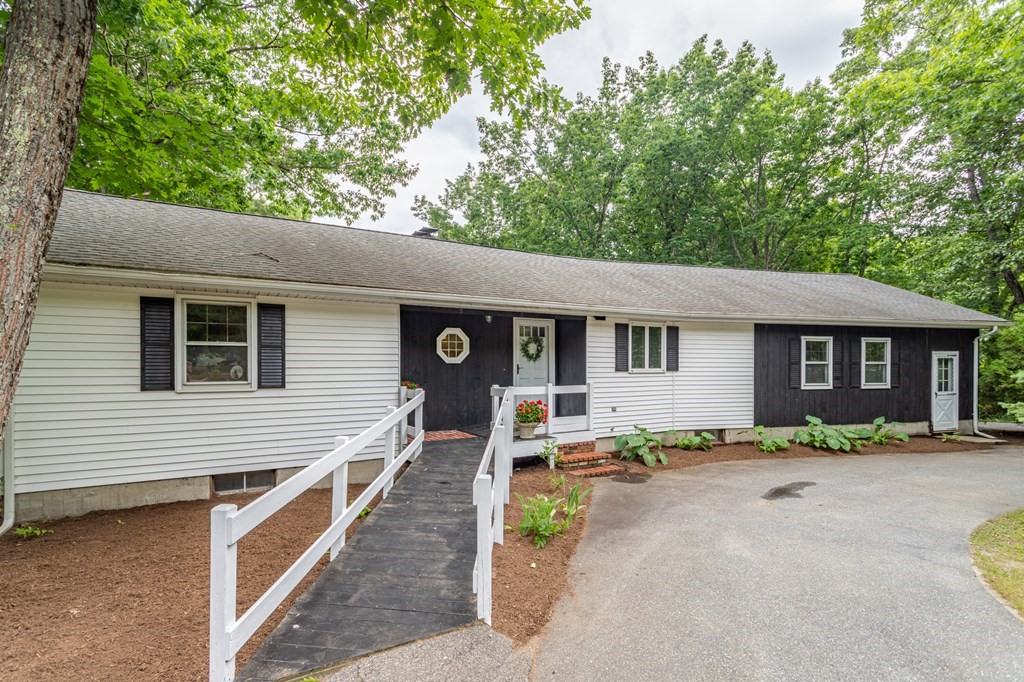 85 Kaleva Road Lancaster, MA 01523 - Photo 1 of 15 a front view of a house with a yard