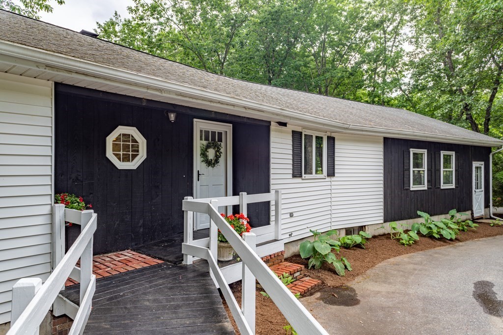 85 Kaleva Road Lancaster, MA 01523 - Photo 2 of 15 a front view of a house with garden
