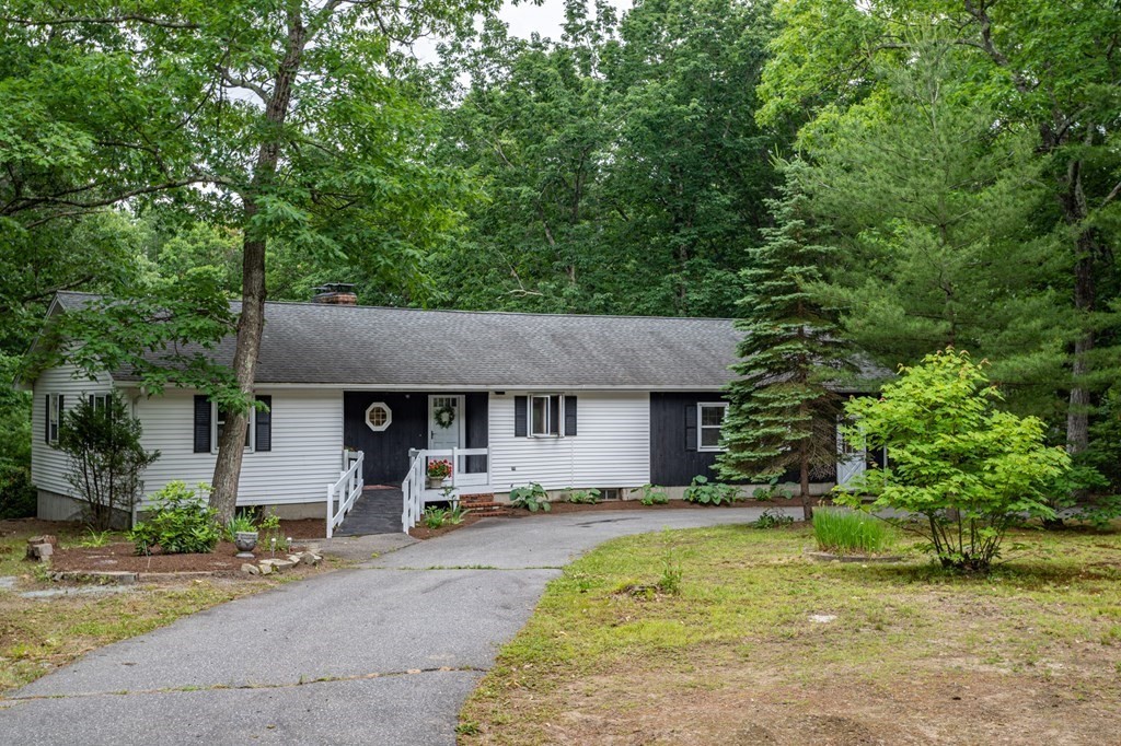 85 Kaleva Road Lancaster, MA 01523 - Photo 4 of 15 a front view of house with yard and trees in the background