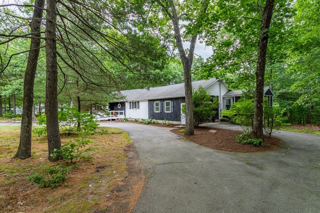 85 Kaleva Road Lancaster, MA 01523 - Photo 6 of 15 a front view of a house with a garden