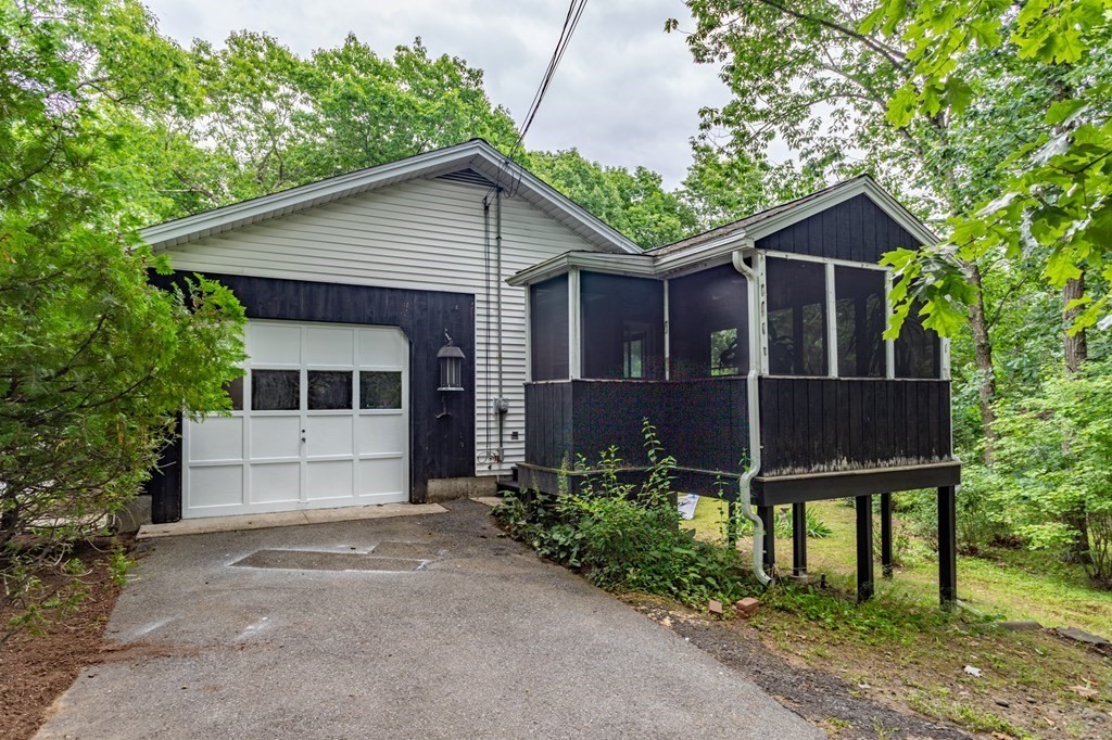 85 Kaleva Road Lancaster, MA 01523 - Photo 7 of 15 a view of a house with a yard and large tree
