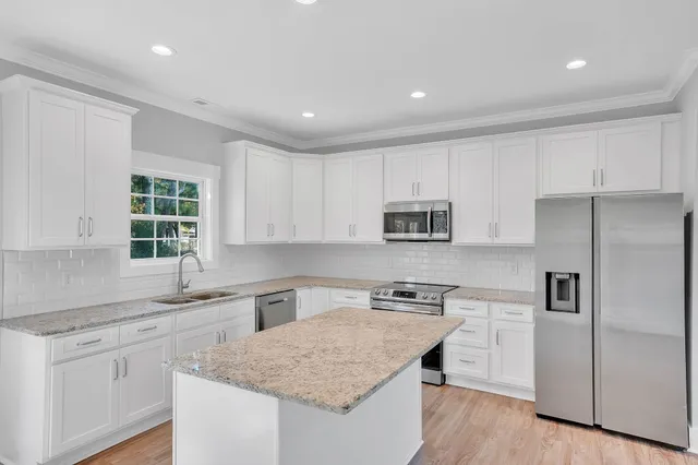 a bathroom with a shower and a glass door