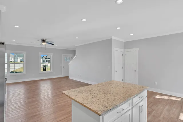 a bathroom with a tub a sink and mirror