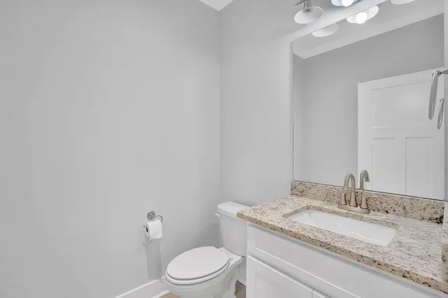 an empty room with a ceiling fan and a window