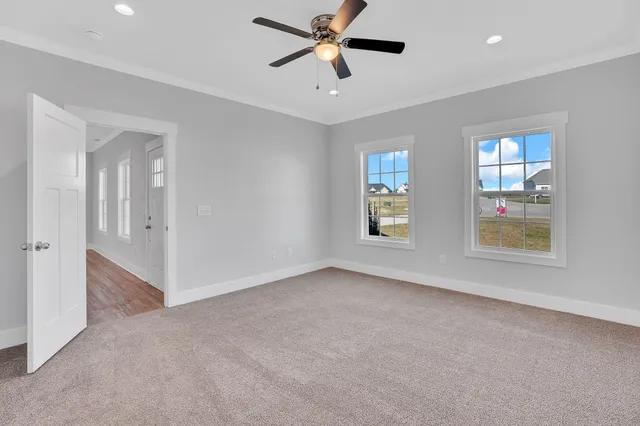 a bathroom with a granite countertop sink a toilet and shower