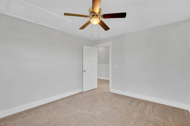 a view of a yard with a tree