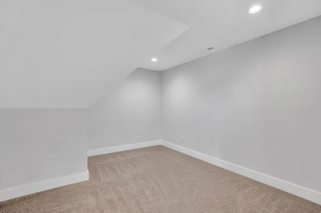 an aerial view of a house with outdoor space