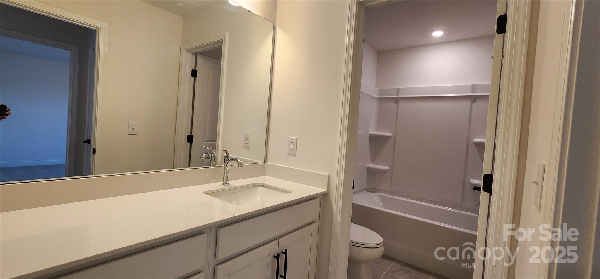 734 Sirius Lane York, SC 29745 - Photo 11 of 23 a bathroom with a granite countertop sink toilet and shower