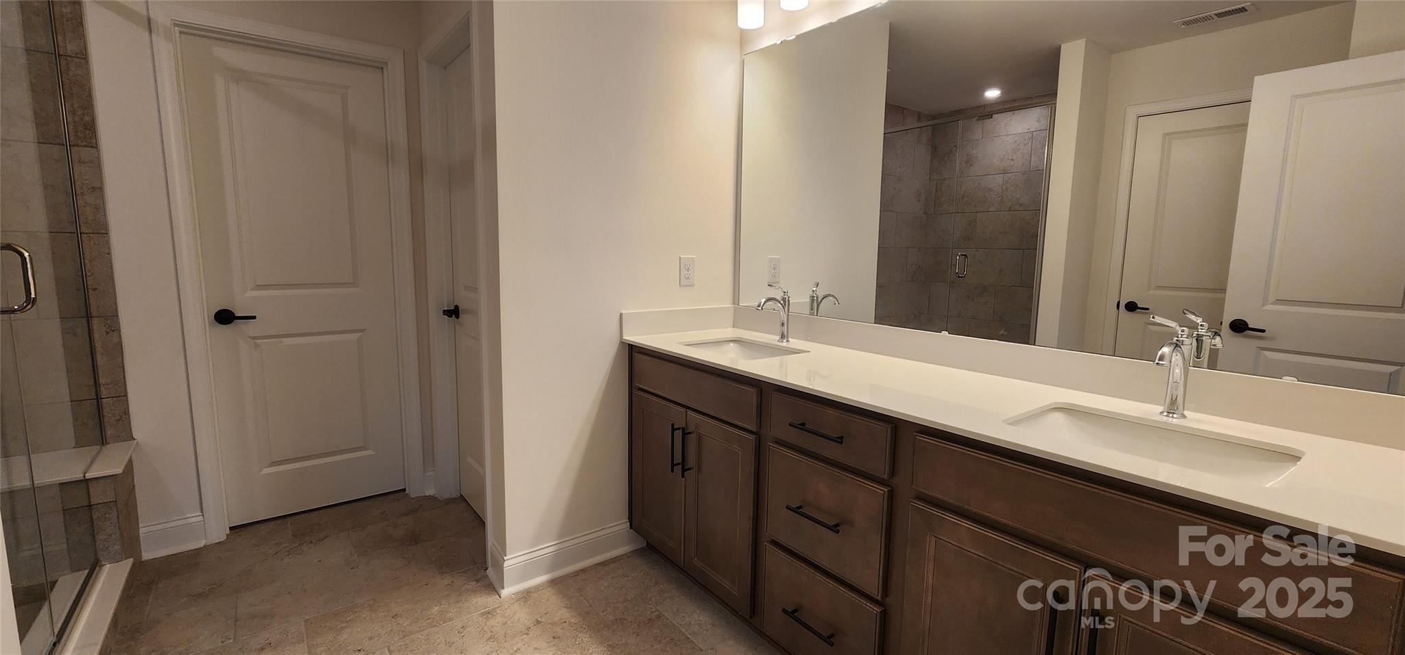 734 Sirius Lane York, SC 29745 - Photo 8 of 23 a bathroom with double sink and a mirror