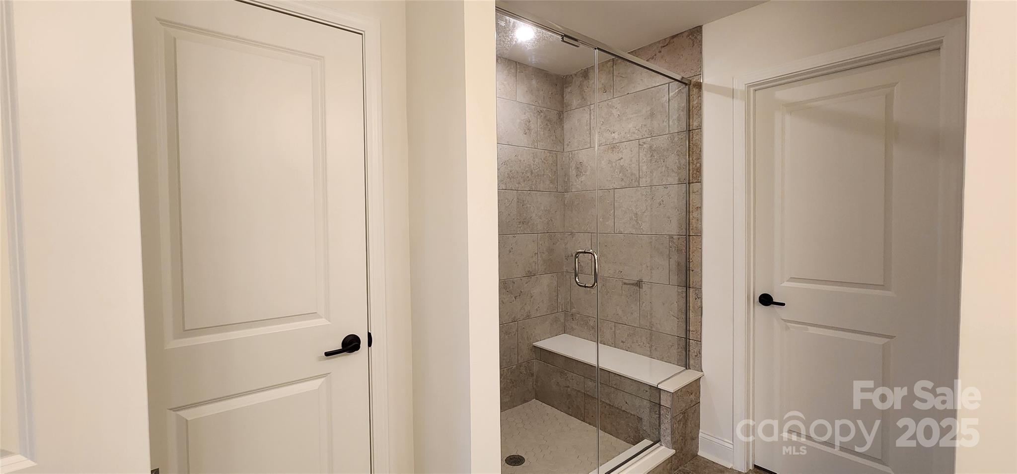 734 Sirius Lane York, SC 29745 - Photo 9 of 23 a bathroom with a glass shower door