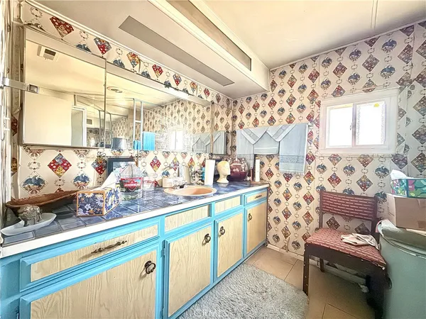 a view of a livingroom with workspace and a couch