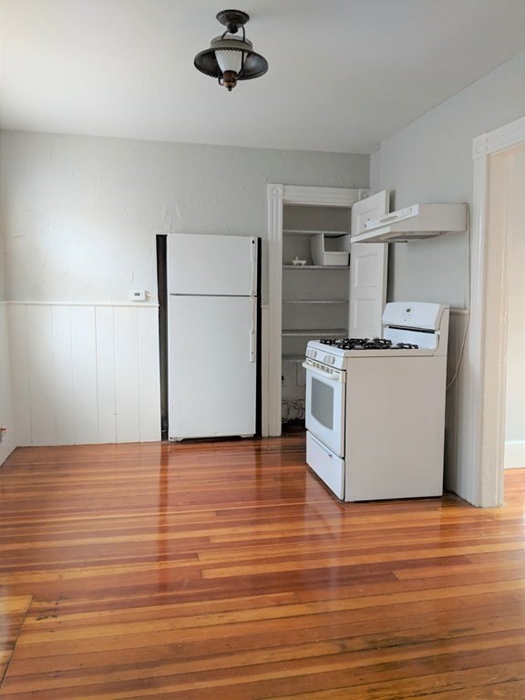 6 Proctor Street Salem, MA 01970 - Photo 12 of 26 a kitchen with stainless steel appliances granite countertop a stove and a refrigerator
