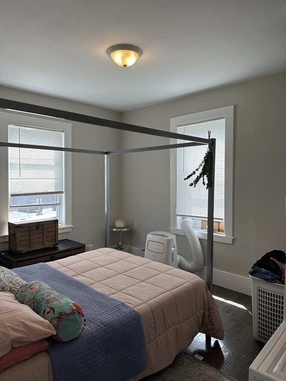 6 Proctor Street Salem, MA 01970 - Photo 6 of 26 a bedroom with a bed and wooden floor