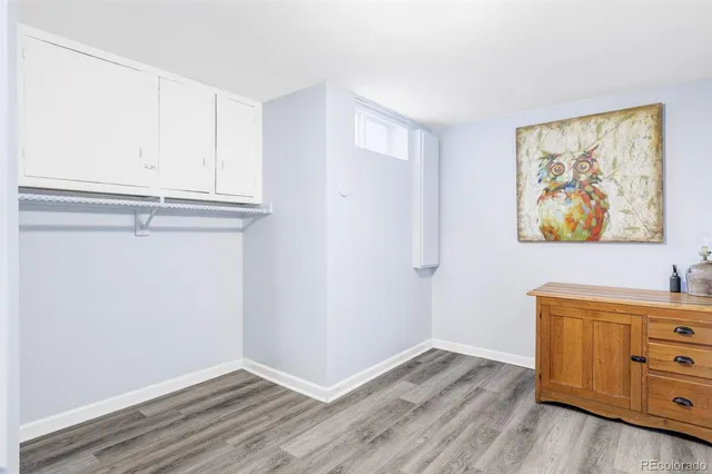 a view of room with window and wooden floor