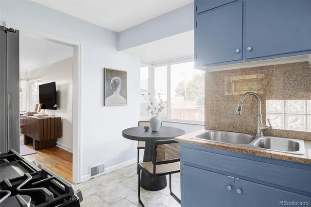 a kitchen with sink and window